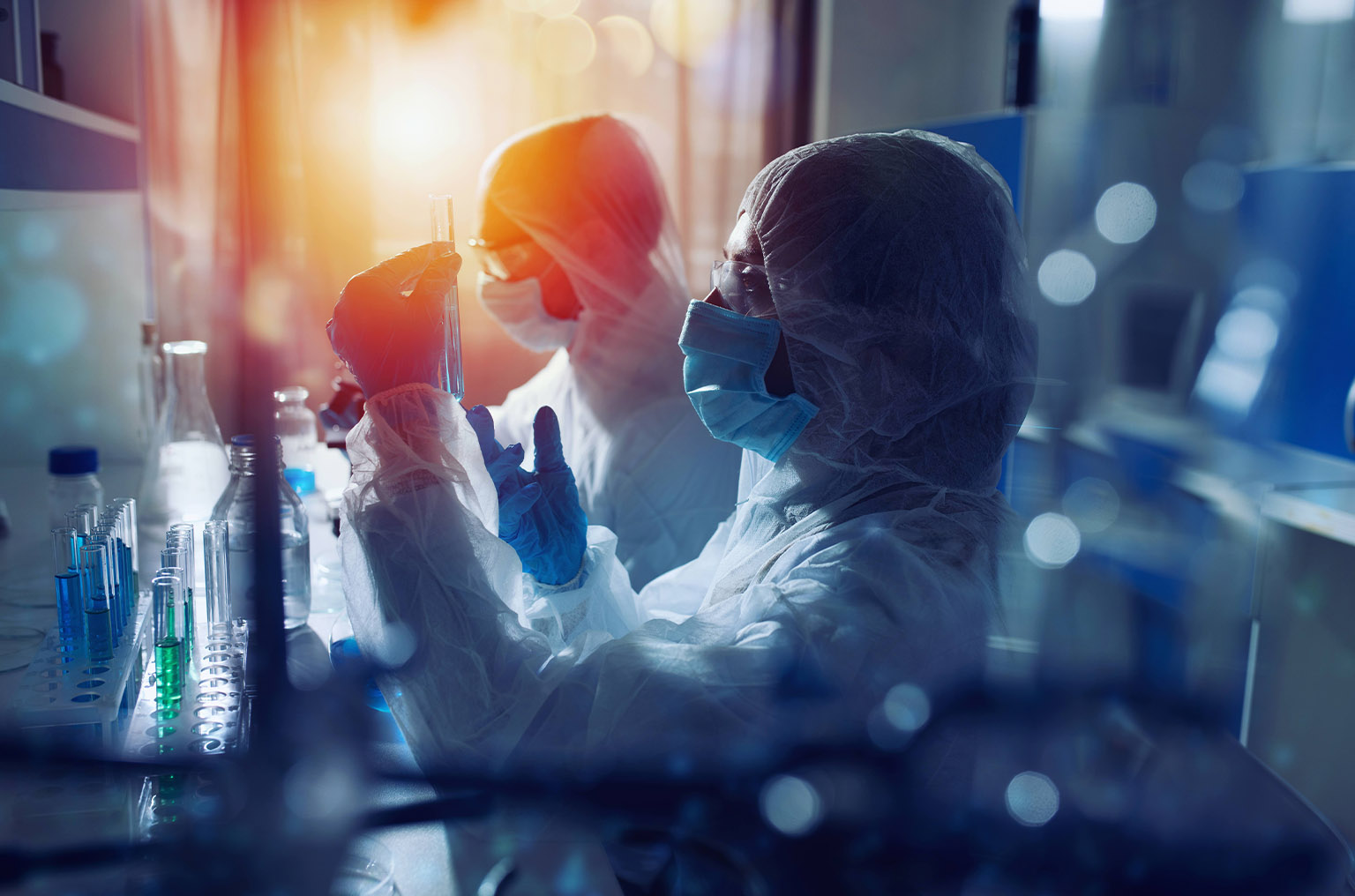 Masked research assistants in lab